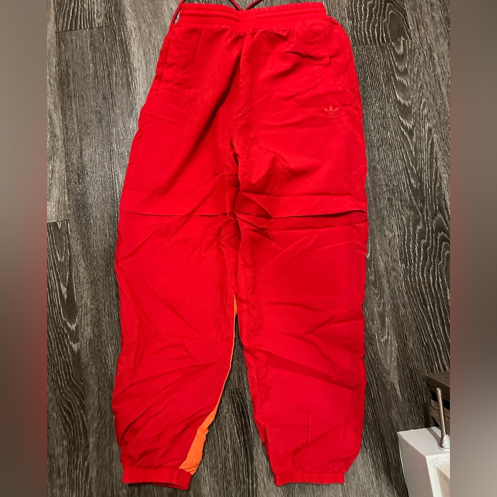 NWOT Woman’s Adidas warm up pants size S.  Brand new never worn.